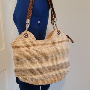 The sak tan and blue crochet purse